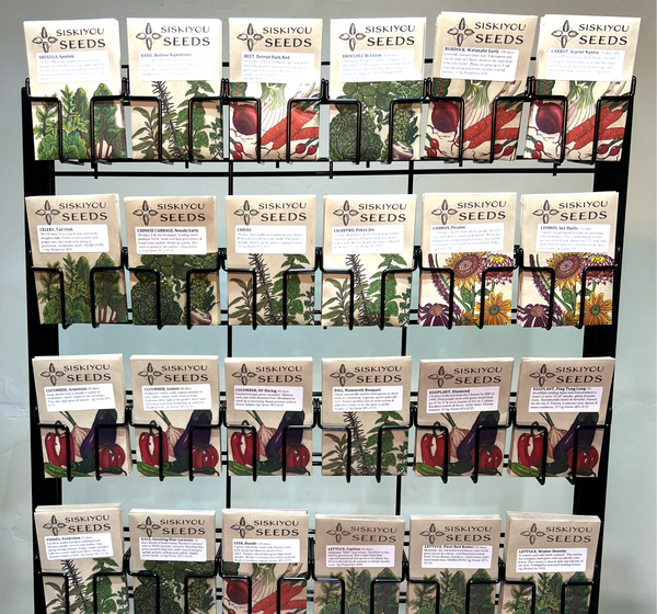 Display rack with various seed packets on a neutral background